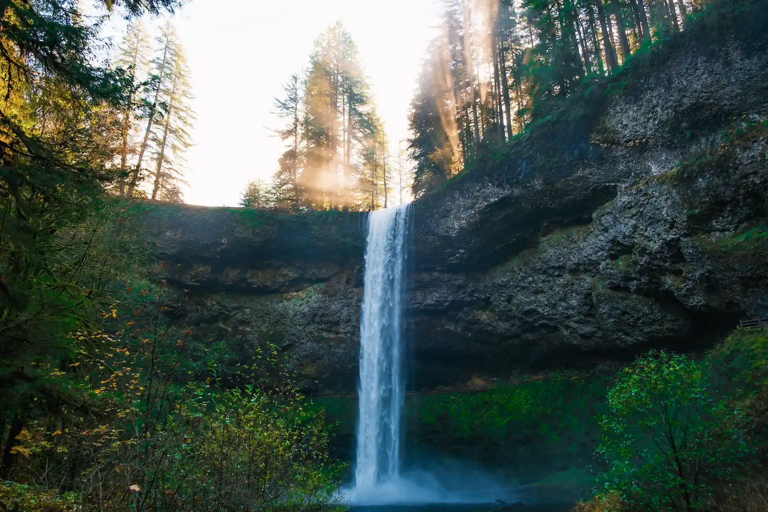 Golden sunrise over a waterfall