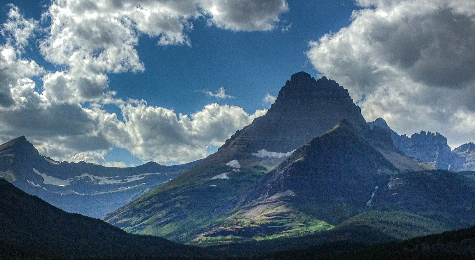 Mountain range with clouds at Glacier National Park